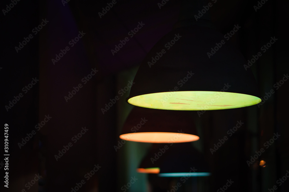 Group of colored round lamps in the dark