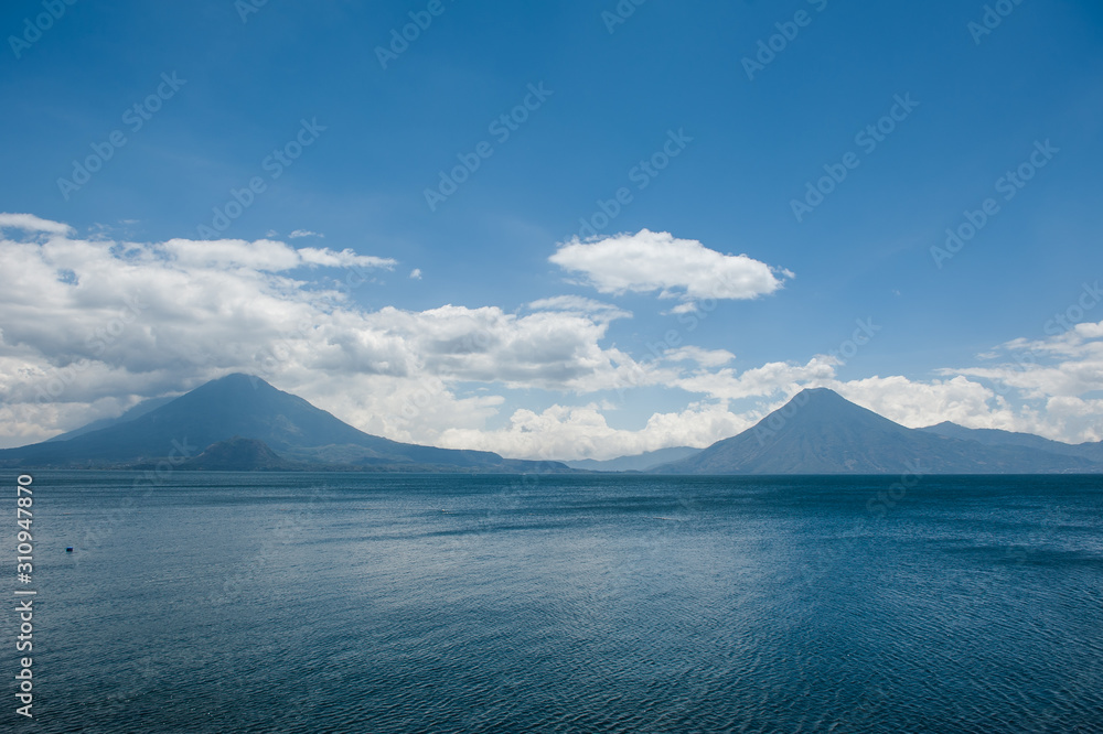 Twin volcanoes on the lake's horizon in Central America
