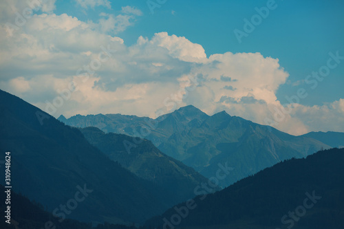 Beautiful view of spring landscape on the mountains and peaks in the snow in the Alps. Austria