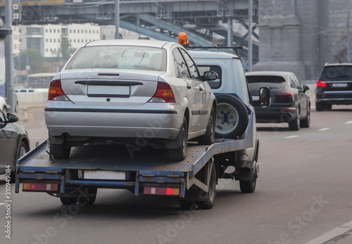 car tow truck transports a car