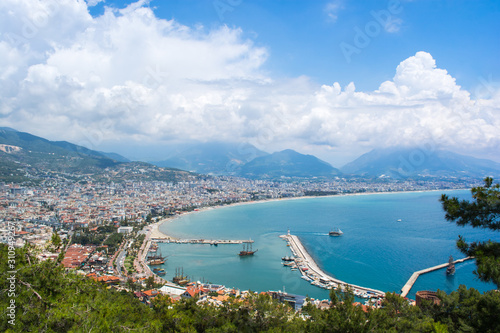 Great aerial view on sea resort, clear blur wather, beach, mountains and coastline with hotels. photo