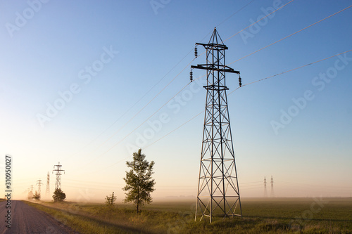 Power Lines on Canadian Prairie at Sunrise in Summer
