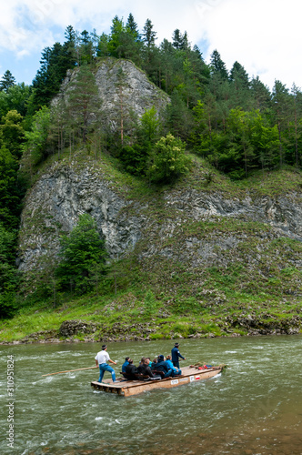 Tourists on the raft. Dunajec river in Pieniny Mountains. Poland.