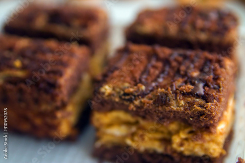 Wallpaper Mural Chocolate cake with yellow cream sliced close-up. Torontodigital.ca