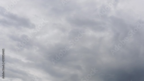 White clouds with blue sky in slow motion clip.