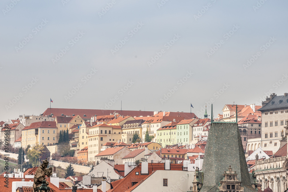 Panorama of the Prague Castle (Prazsky Hrad) hill, also called Hradcany, in Czech Republic, seen from the mala strana district, with its typical baroque architecture buildings and and medieval streets