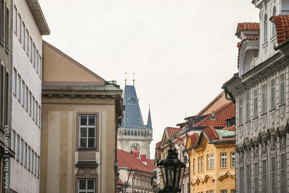 Old Town Hall tower, a clock tower, in Prague, Czech Republic, taken from the narrow streets of Old Town. Also called Staromestska radnice, the Old Town Hall is a major landmark of the city