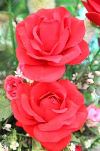 Closeup of artificial red rose flowers