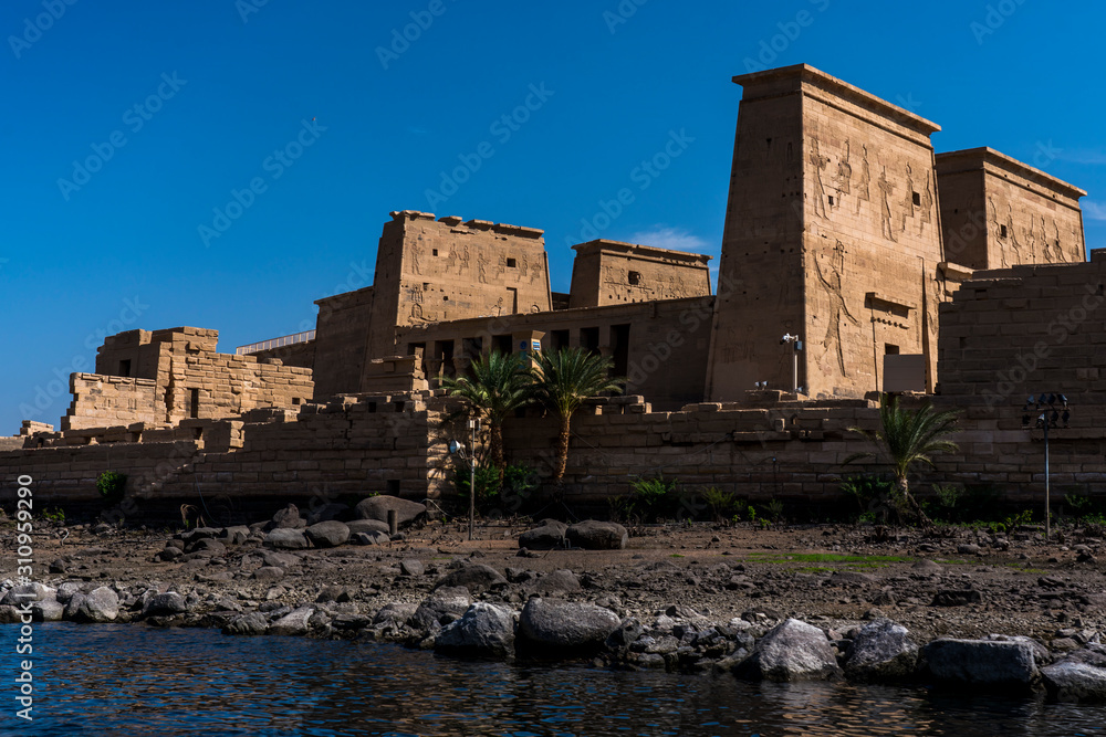 Philae Temple is located on an island of the Aswan Low Dam, downstream of the Aswan Dam and Lake Nasser, Egypt.