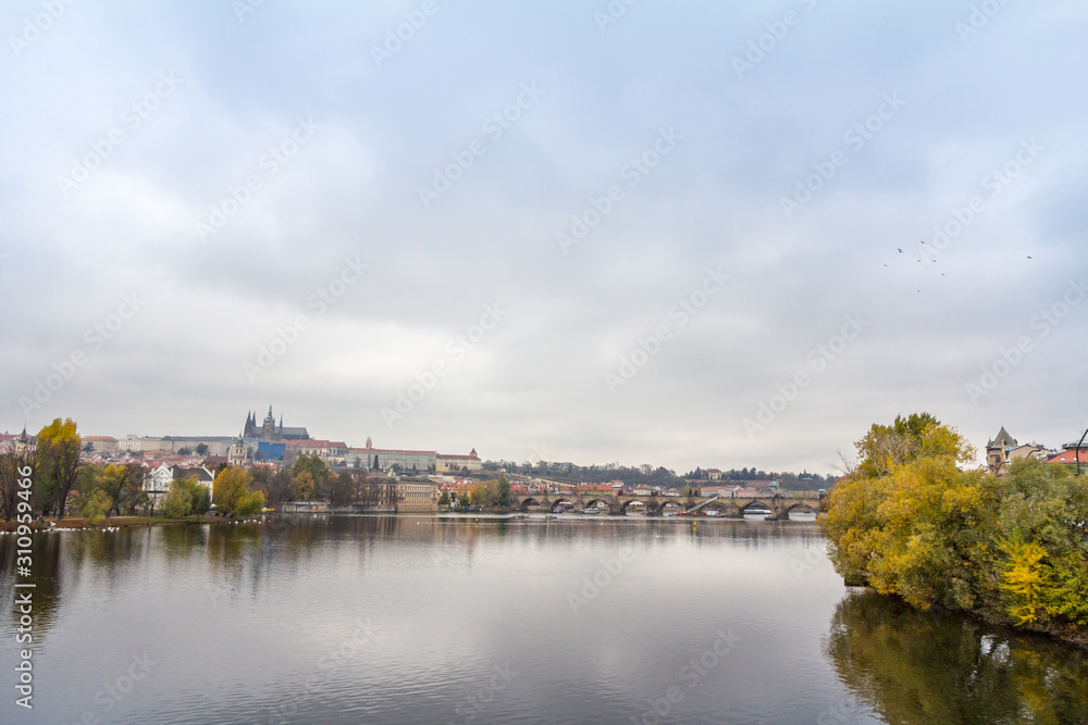 Panorama of the Old Town of Prague, Czech Republic, with a focus on Charles bridge (Karluv Most)  and the Prague Castle (Prazsky hrad) seen from the Vltava river.  It is the main touristic landmark 