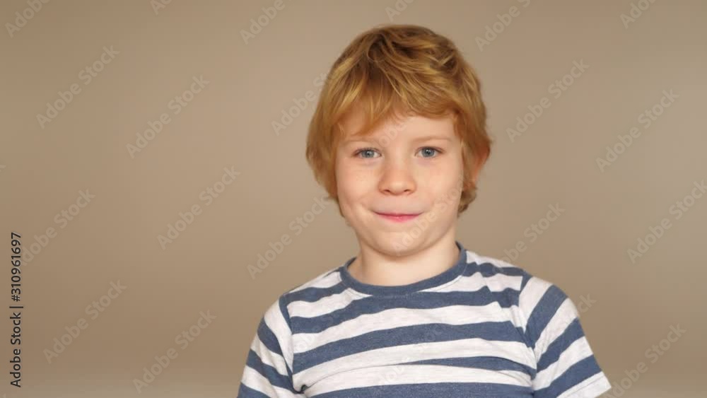 Funny boy with milk tooth gap grimaces in front of the camera Funny boy with milk tooth gap grimaces in front of the camera