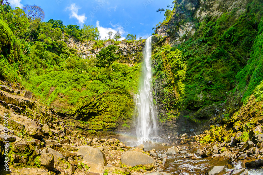 Lnadscape view of Coban Rondo waterfall in Pujon, Malang, East Java, Indonesia