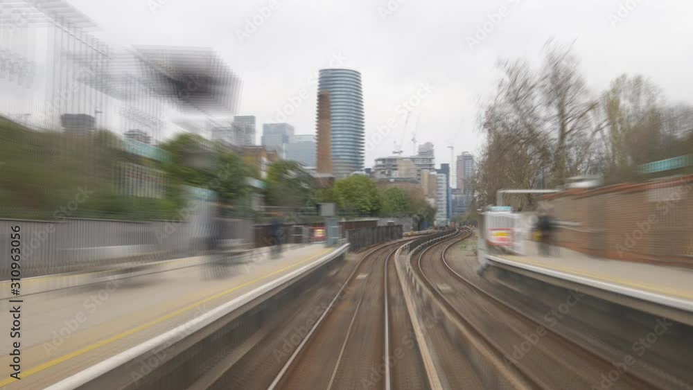 Time lapse. A train coming through a tunnel and onto a station. Time lapse. A train coming through a tunnel and onto a station.