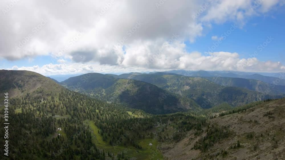 Flying over the valley in mountains. Aerial view of beautiful mountain landscape. Drone flies forward Flying over the valley in mountains. Aerial view of beautiful mountain landscape. Drone flies forward