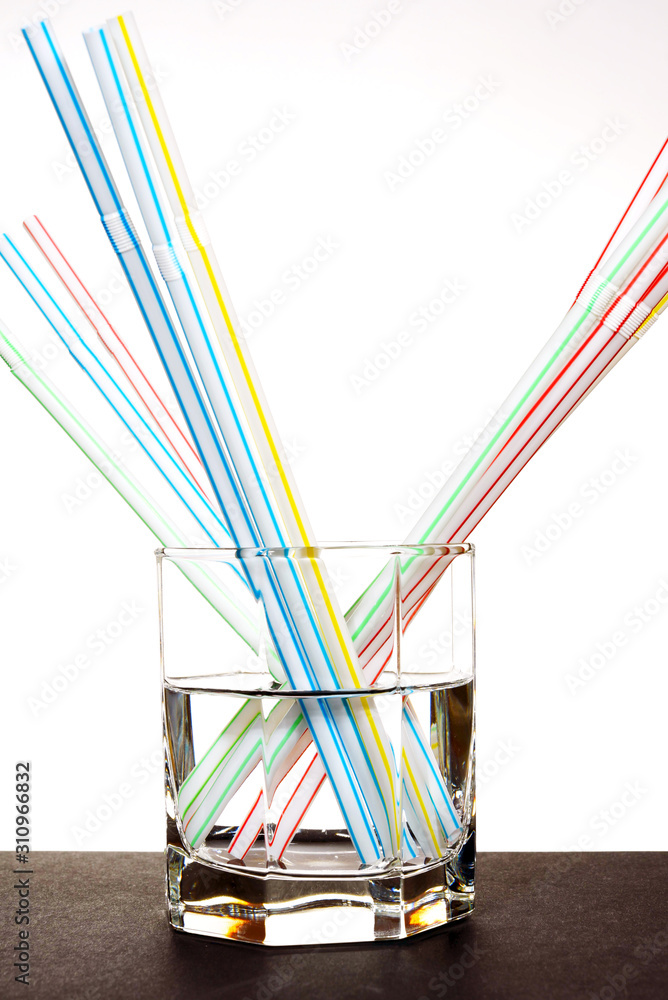 a glass of pure water with a straw for a cocktail a glass of pure water with a straw for a cocktail