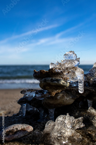 Photography Frozen shapes of rock and sand in the beach in the winter