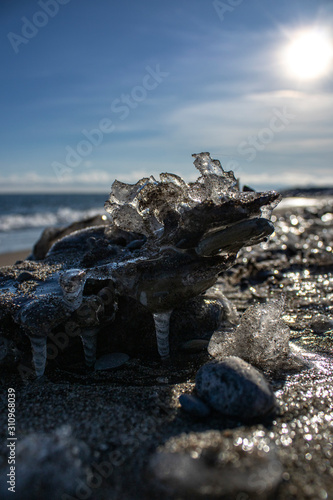 Photography Frozen shapes of rock and sand in the beach in the winter