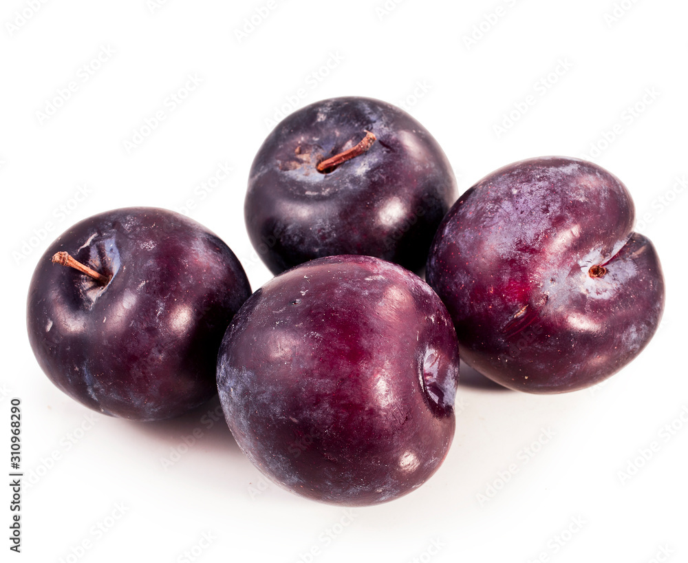 Obraz premium Red plums heap isolated on a white background.