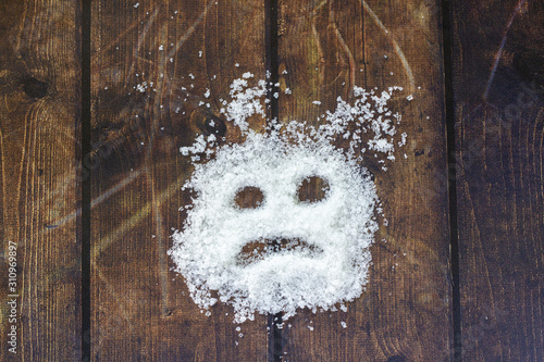 Sugar form an evil face to represent what happened if taken in uncontrolled portion. Conceptual