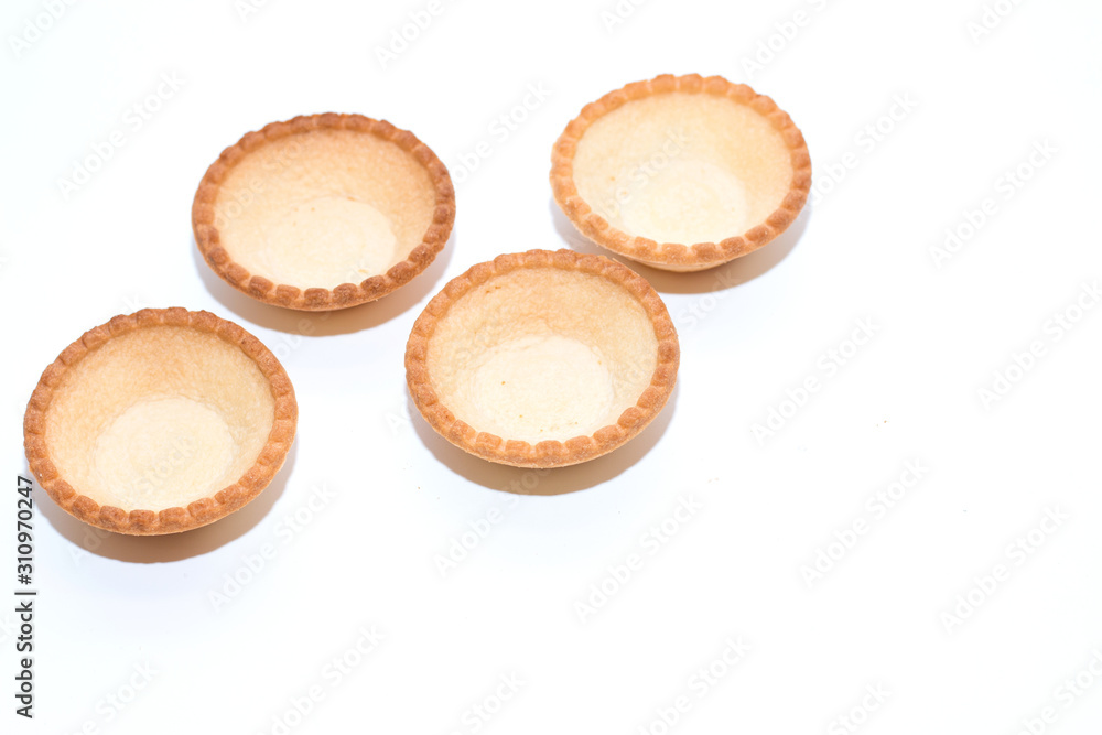 Empty tartlets on a white background for a festive buffet reception. The concept of cooking.