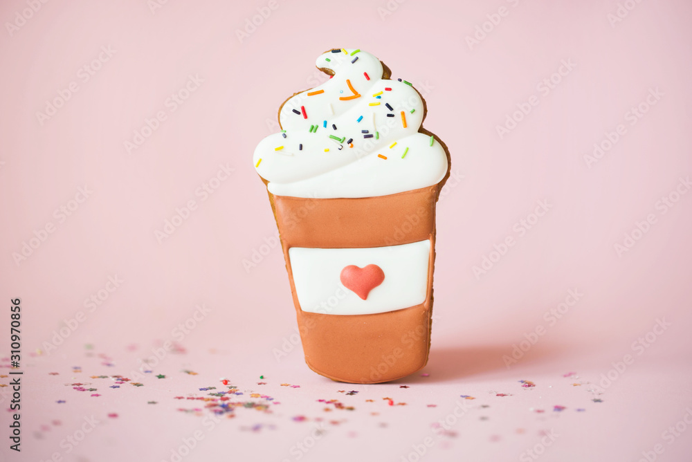 Fragrant gingerbread in the form of doughnuts on a pink background with sequins of small multi-colored stars and donut inscription. Flat lay Fragrant gingerbread in the form of doughnuts on a pink background with sequins of small multi-colored stars and donut inscription. Flat lay