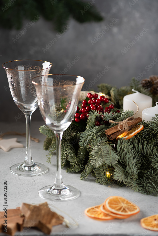 Rose champagne in a glass on the background of a Christmas wreath
