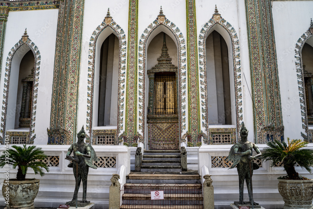 Detailed and ornate doorway views of temple at the Grand Palace in Bangkok Thailand