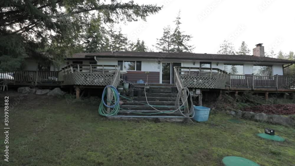 Old house back deck in wilderness Old house back deck in wilderness