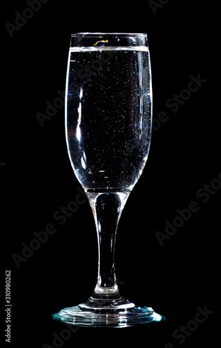 Water in a glass on a black background
