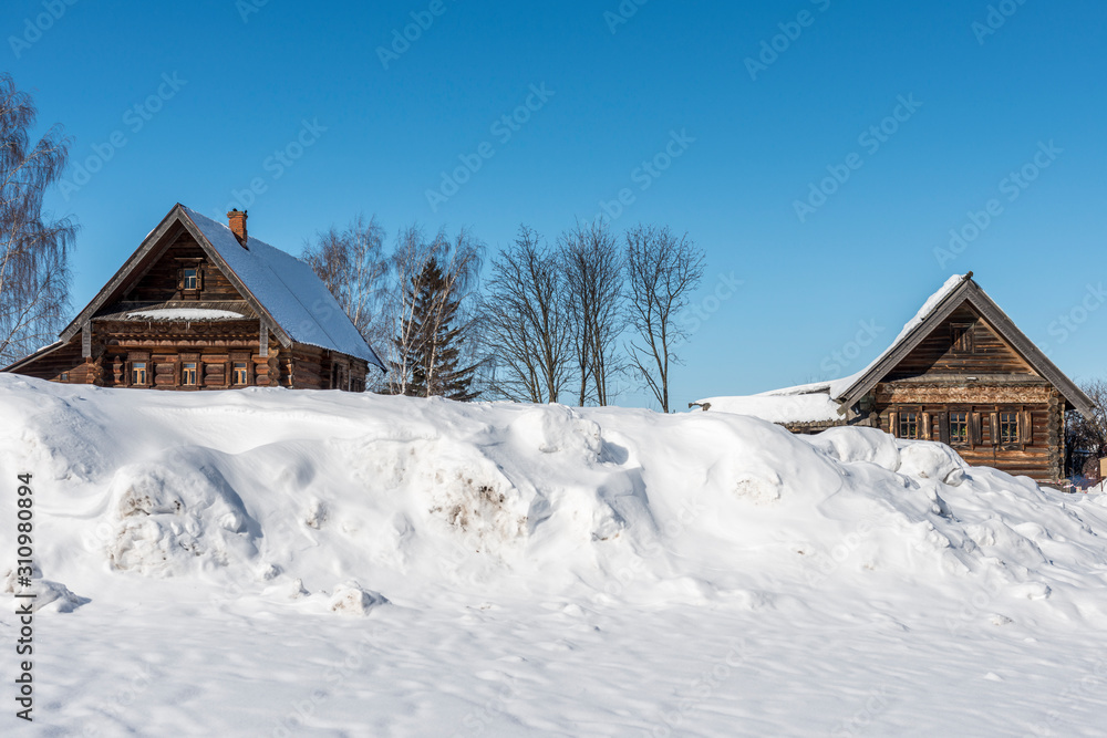 Typical old russian house covered with snow/ Winter Landscape/ Suzdal/ Russia/ Golden Ring of Russia Travel