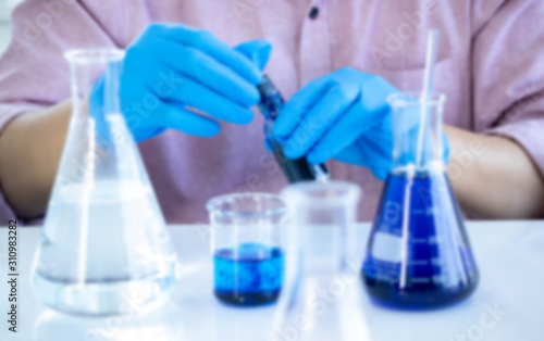 The concept of medical, chemicals or scientific laboratory research and Innovation in the laboratory. experienced man scientist is performing work chemical liquid in the laboratory.