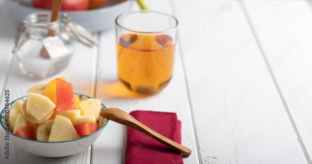 Fresh fruit salad in a blue bowl Fresh fruit salad in a blue bowl