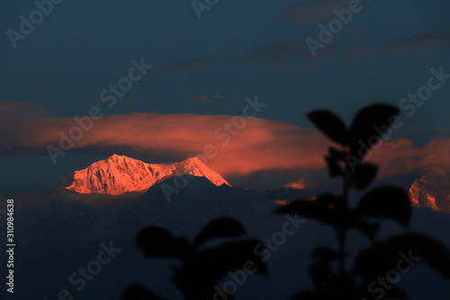 Kanchanjungha during golden hour, snow, peak, landscape, nature, Himalayan. Snowy mountains of Himalaya. A beautiful snowy mountain landscape under a blue cloudy sky.. photo