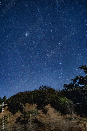 starry night sky on the beach cliifs