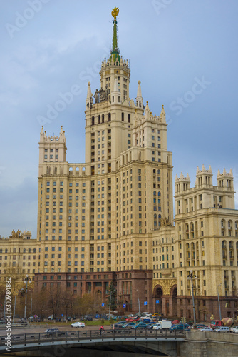 The central part of Stalin skyscraper on Kotelnicheskaya embankment closeup on a cloudy April day photo