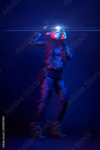 Woman wearing virtual reality headset. Image with glitch effect