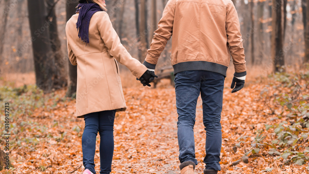 Couple in the park enjoying nice autumn / winter time. Couple in the park enjoying nice autumn / winter time.