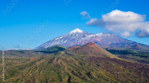 Spain, Tenerife, Impressive mountain nature landscape surrounding mount teide, covered by snow in winter, aerial view