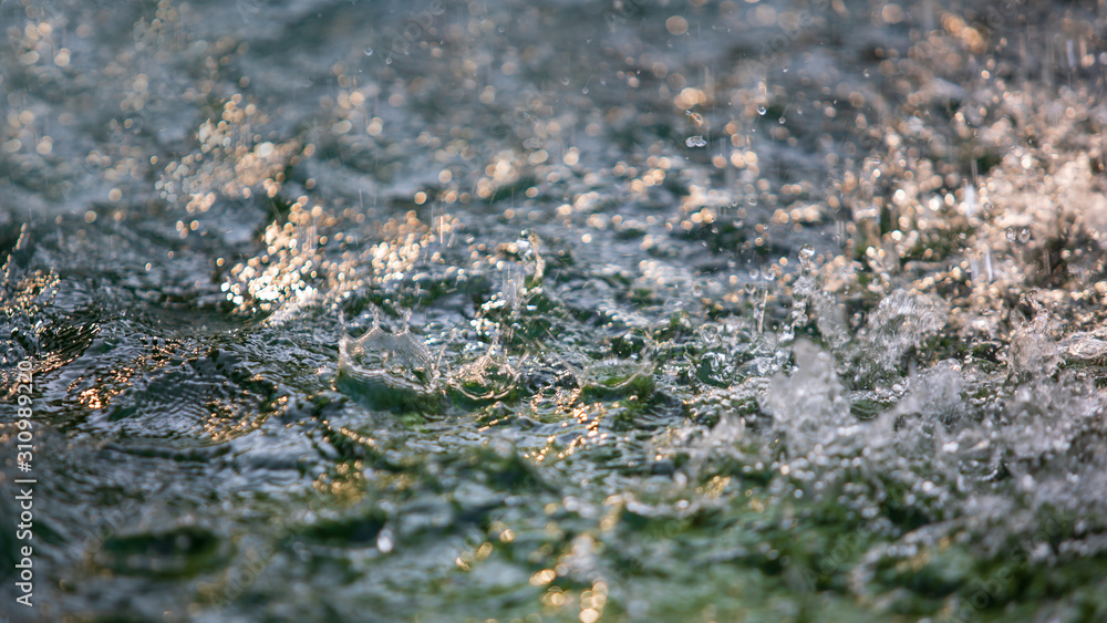 Abstract image of water splash from fountain or rain. Abstract image of water splash from fountain or rain.