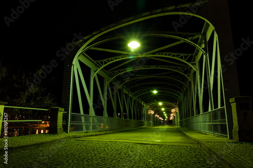 Old iron Bridge over Vltava river in Tyn nad Vltavou, Czech Republic. © Sergey Fedoskin