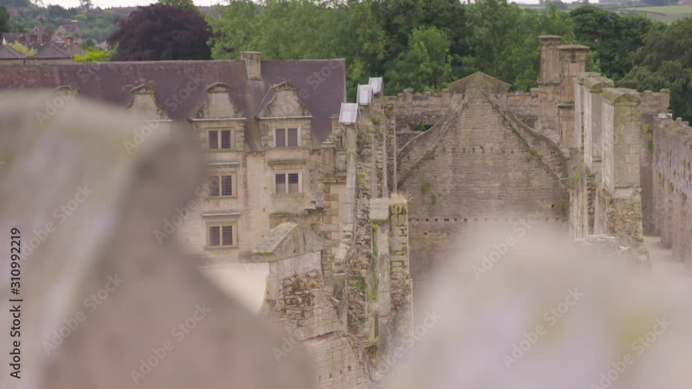Medium low angle tracking focus daytime shot of the roofs of buildings around Bolsover Castle, Derbyshire, UK Medium low angle tracking focus daytime shot of the roofs of buildings around Bolsover Castle, Derbyshire, UK
