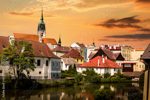 Jindrichuv Hradec panoramic cityscape with Vajgar pond in the foreground on a sunset. Czech Republic. photo