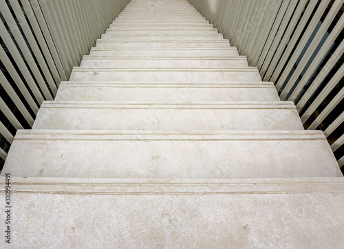 Image of way down the write cement stairs.