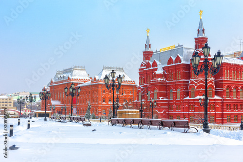 Moscow in cold winter, Russia. Scenery of old historical buildings on the snowy Manezhnaya Square near Moscow Kremlin.