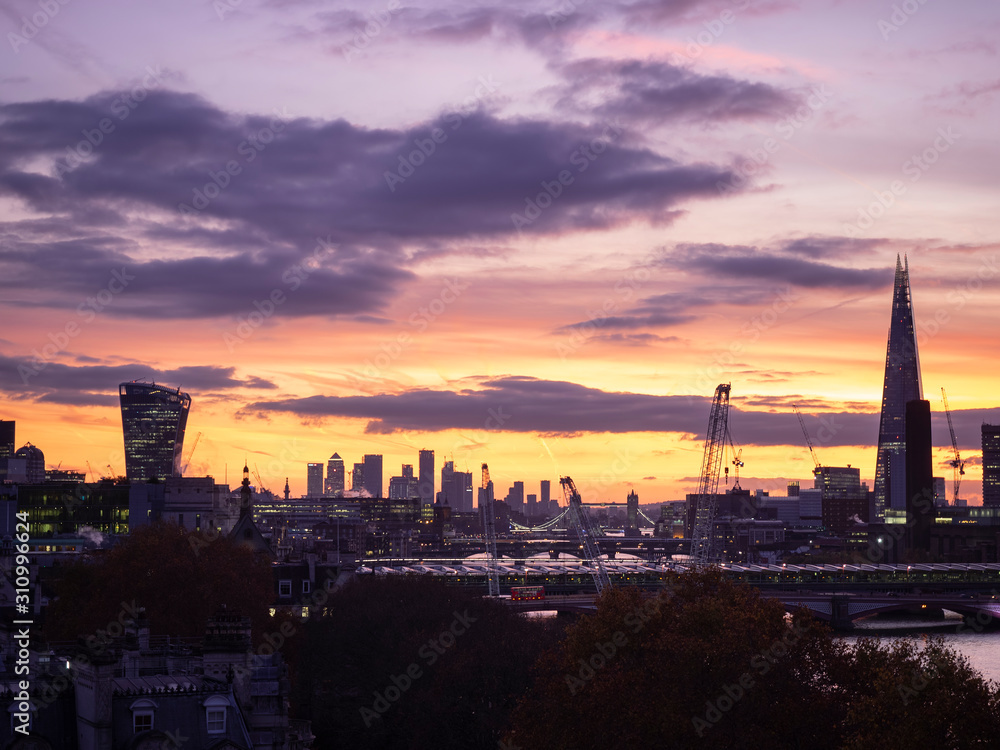 Epic dawn sunrise landscape cityscape over London city sykline looking East along River Thames