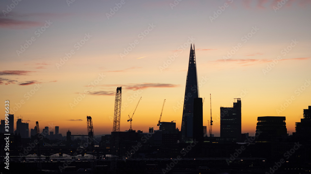 Epic dawn sunrise landscape cityscape over London city sykline looking East along River Thames