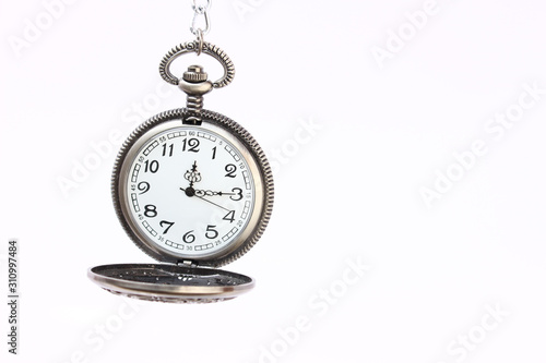 old pocket watch with chain isolated on white