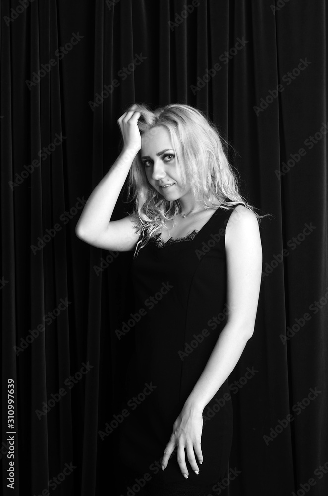 Fashion photo of young lady in elegant black dress Fashion photo of young lady in elegant black dress