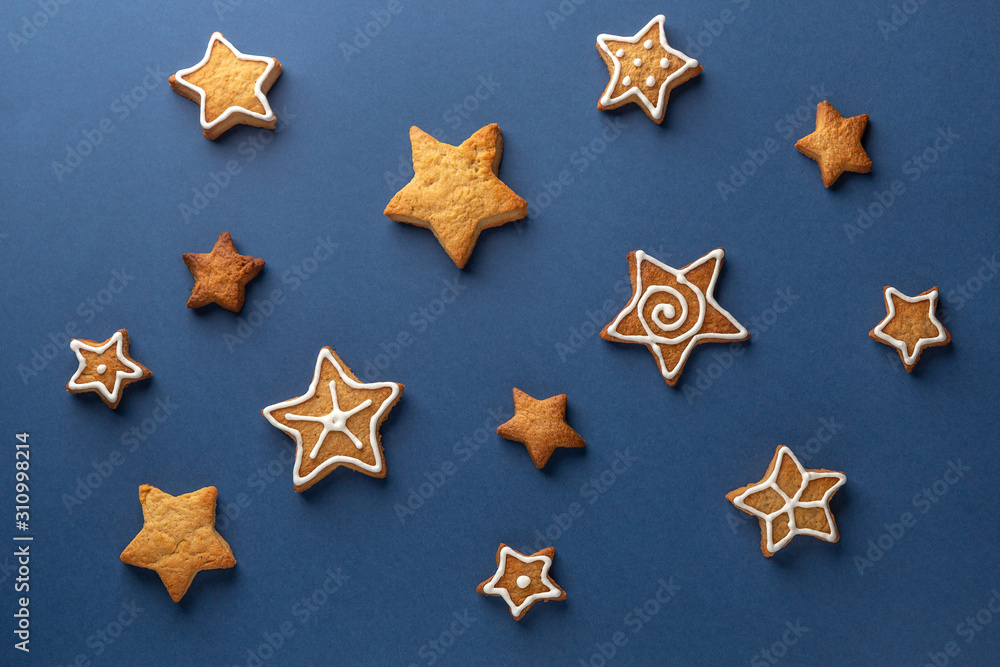 Ginger cookie stars on a blue background Ginger cookie stars on a blue background