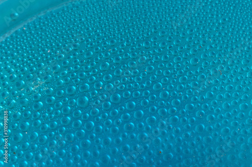 Blue water drops background close up
